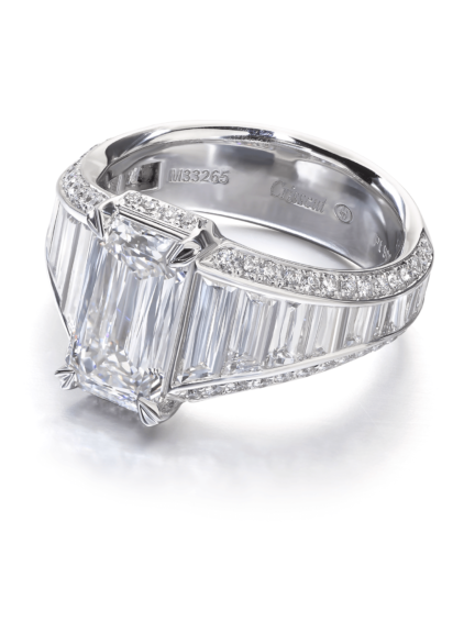 Unique emerald cut diamond  white gold engagement ring with tapered baguette and round diamond setting