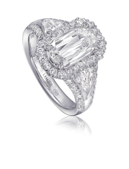 Deco inspired diamond engagement ring set in 18K white gold with trapezoid side diamonds