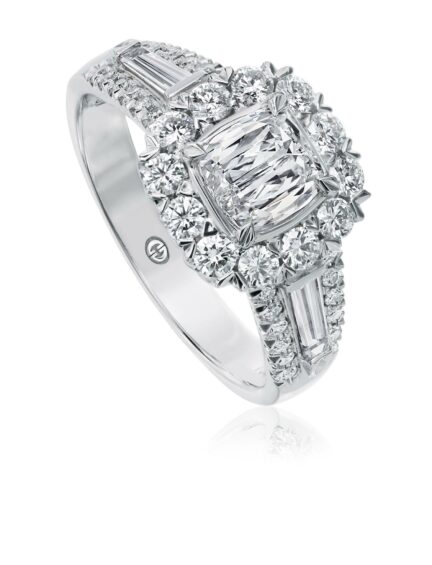 Halo engagement ring with cushion cut diamond with baguette and round diamond sides