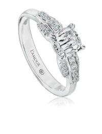 Simple engagement ring with cushion cut diamond and round diamond setting