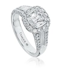 Halo engagement ring with cushion cut diamond with tapered baguette and round diamond sides