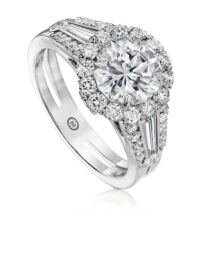 Classic halo engagement ring setting with tapered baguettes and round diamonds
