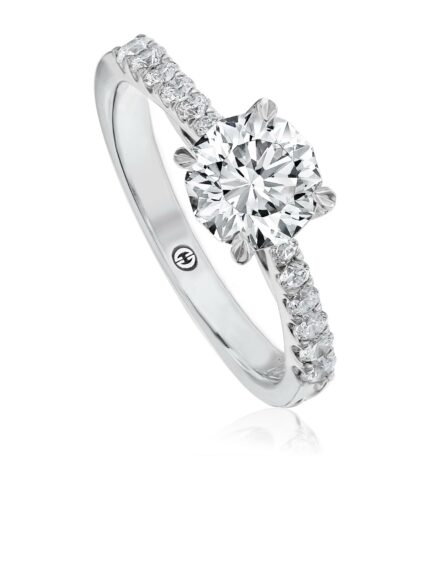 Classic solitaire engagement ring setting with diamond band