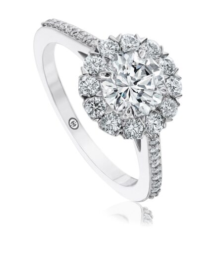 Traditional halo engagement ring setting with pave set diamond band