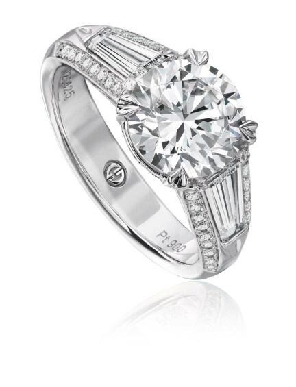 White gold solitaire engagement ring setting with tapered baguette and round diamond band