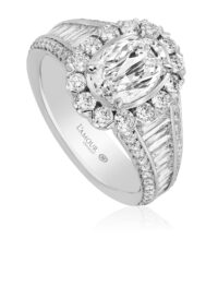 Oval diamond engagement ring with halo and tapered baguette and round diamond band